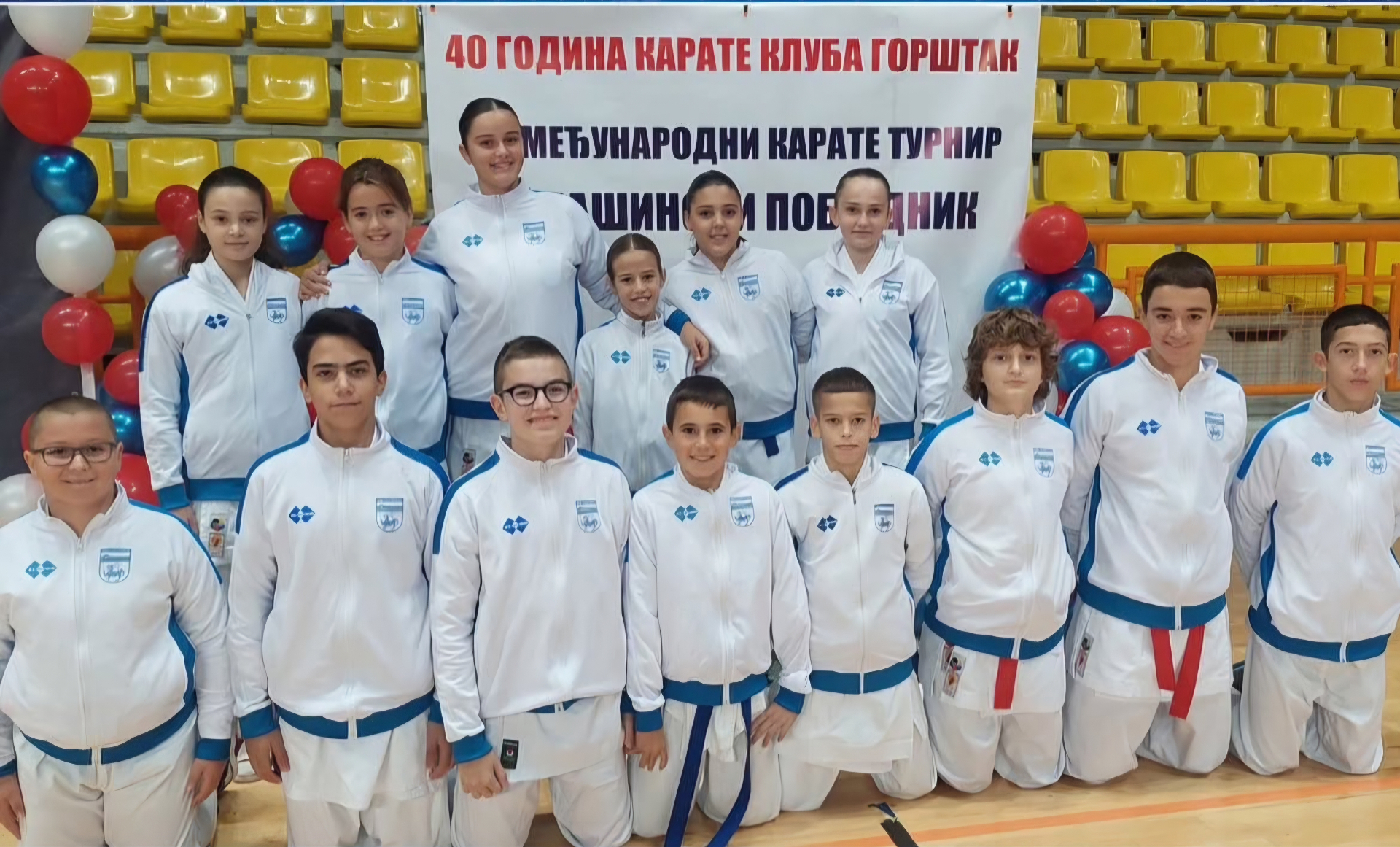 The Podgorica Karate Club team in a group photograph in a sports hall