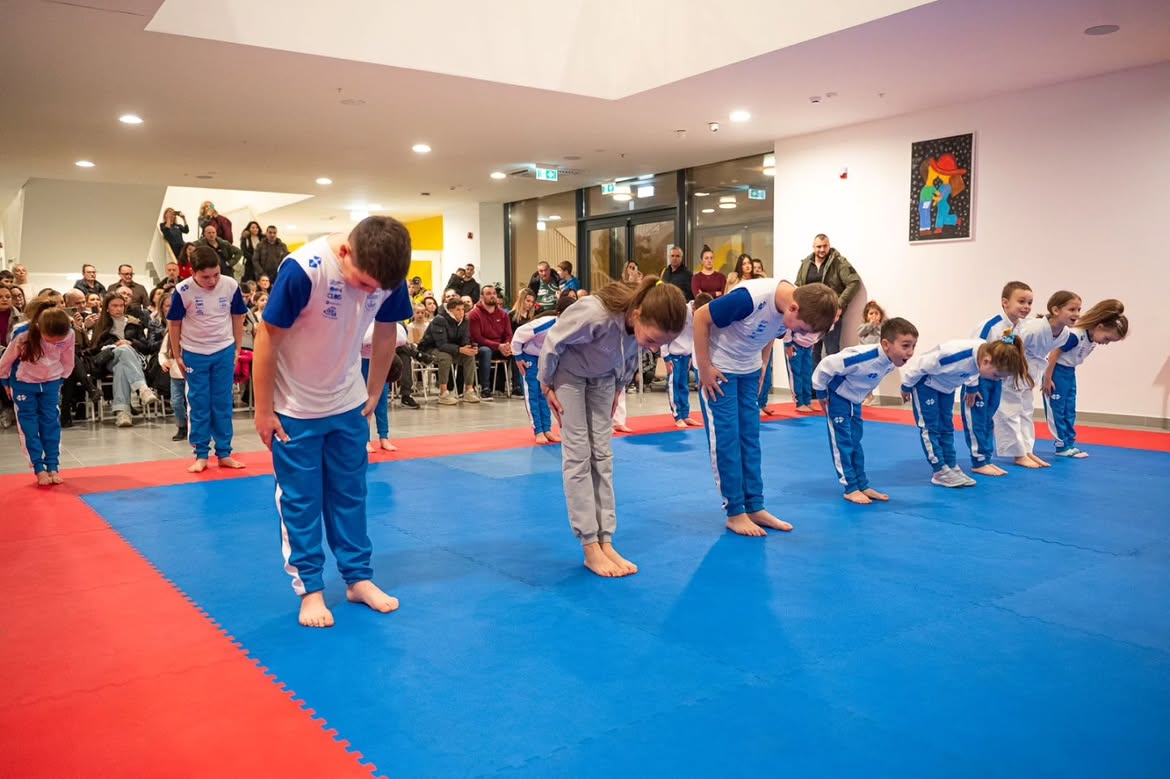 Club children performing together for an audience at a public event